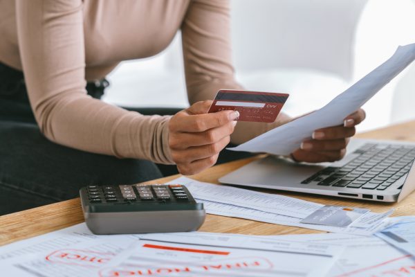 Stressed young woman has financial problems with credit card debt to pay crucial show concept of bad personal money and mortgage pay management crisis. sad and unhappy